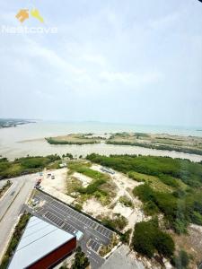 an aerial view of a parking lot next to the water at Imperio Residences Private Bathtub or Jacuzzi by Nestcove in Malacca