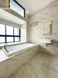 a bathroom with a bath tub and a sink at Imperio Residences Private Bathtub or Jacuzzi by Nestcove in Malacca +131 photos