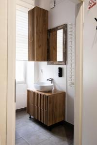 a bathroom with a sink and a mirror at FiveHostel in Krakow +56 photos