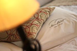 Mon Petit Hotel客房内的一张或多张床位