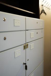 a stack of white dressers in a room at Fivehostel in Krakow
