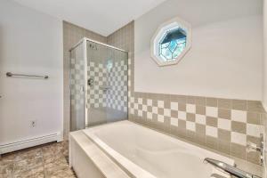 a bathroom with a tub and a glass shower at Minnow's Run in Kings Beach +18 photos