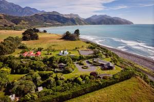 an aerial view of a house on the beach at Mangamaunu Cottage in Kaikoura