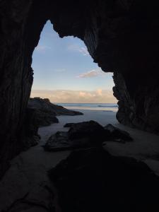 a view of the ocean from inside a cave at Canto da restinga in Paranaguá