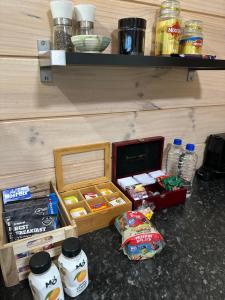 a box of food sitting on the floor next to a shelf at Te Mata Bay Seaviews in Tapu