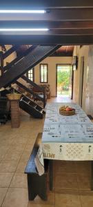 a large table with a pizza on top of it at Trindade Casa Amarela in Trindade