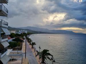a view of a large body of water with buildings at Calma2 in Agioi Theodoroi