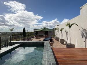 a backyard with a swimming pool and a house at High Standard Two Bedroom Apartment Private Pool Frances Beach Garden 209 in Marechal Deodoro