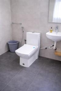 a bathroom with a toilet and a sink at Beverly Hills Vagamon in Vagamon +12 photos