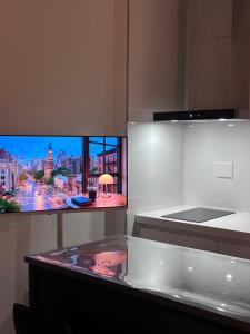 a kitchen with a view of a city at momohouse 체스룸 in Chinyŏng-yŏk