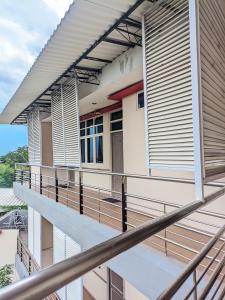 a balcony of a building with wooden shutters at K Residence Surabaya in Surabaya