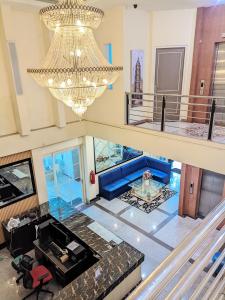 an overhead view of a living room with a chandelier at K Residence Surabaya in Surabaya