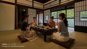 a group of women sitting around a table in a room at AKAMA Kamakura in Kamakura +50 photos