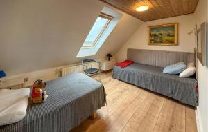 a bedroom with two beds and a window at 4 Bedroom Gorgeous Home In Stege in Stege +13 photos