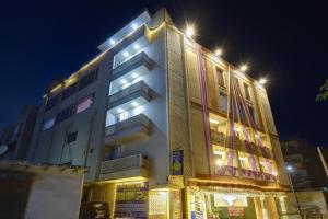 a building with lights on top of it at night at Castle Grand Dwarka in New Delhi