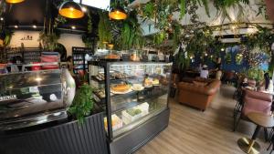 a bakery with a display case filled with food at The Hidden Gem Poshtel Koh Tao in Ko Tao