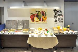 a buffet with a table with food on it at Hotel del Principado Durango in Durango +5 photos