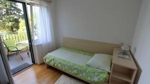 Postel nebo postele na pokoji v ubytování Apartment Malinska 34