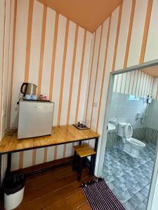 a bathroom with a sink and a toilet at BAAN APA ERAWAN Resort in Ban Pong Pat +72 photos