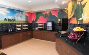 a kitchen with a counter with fruit on it at Fairfield Inn & Suites by Marriott Quincy in Quincy