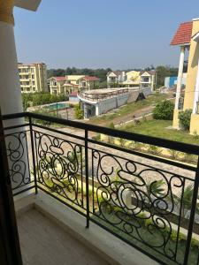 a balcony with a wrought iron railing with a view at Villa 37 in Dhamni