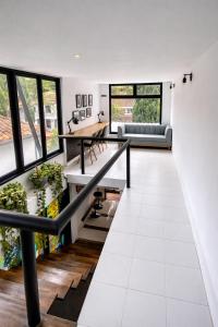 a living room with a table and a couch at Pixel House Hotel in Medellín