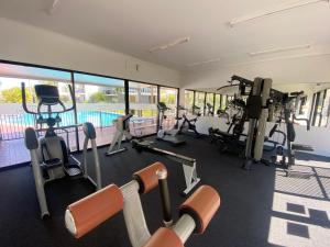 a gym with treadmills and cardio equipment in a building at Seashells - 3BR Marcoola Beach Resort in Marcoola