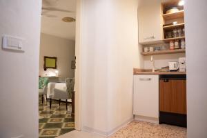 a kitchen and a dining room with a table at Verde romantico in Città della Pieve
