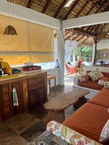 a room with a kitchen and a table in a room at Luxury Casa Cindy in Puerto Escondido