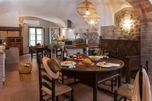a kitchen with a table with food on it at VentallóLEscala. WiFi. Rooftop w stunning views in Ventalló