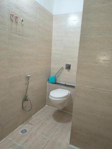a bathroom with a toilet and a shower at 1 Bhk Mayra Homes in Raipur