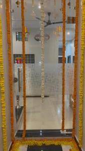 a view of a room with a window with orange pillars at Shyam Hotel & Janmasa in Rewa