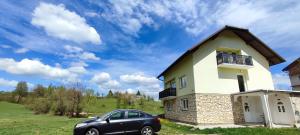 a car parked in front of a house at Villa Ruscello in Grabovac
