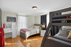a bedroom with a bunk bed and a desk at Summit Chalet at Stillwater in Pocono Summit +63 photos