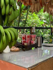 a counter with bunches of bananas and eggs on it at Buon'S garden in Buôn Kao +41 photos