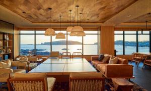 a living room with a large table and chairs at Fairfield by Marriott Wakayama Kumano Kodo Susami in Susami