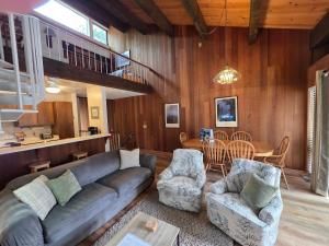 a living room with a couch and chairs and a table at Spiral Staircase home in Kings Beach