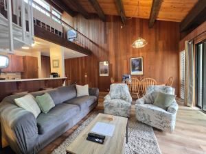a living room with a couch and two chairs and a table at Spiral Staircase home in Kings Beach