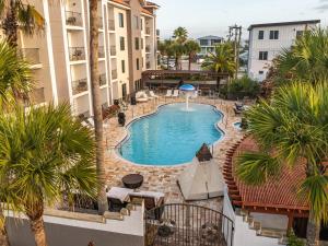 an overhead view of a swimming pool in a hotel at Castillo Real St Augustine Beach,Tapestry Collection Hilton in Saint Augustine Beach
