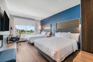 a hotel room with two beds and a large window at Tru By Hilton Augusta Washington Road in Augusta +44 photos