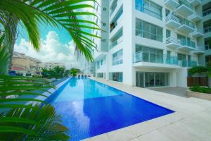 a large swimming pool in front of a building at Boca del mar III in Boca Chica