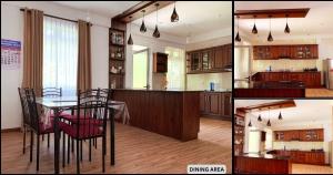 a kitchen and a dining room with a table at Hillside Home in Kundasale