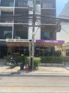 a motorcycle parked in front of a building at Vera House in North Pattaya