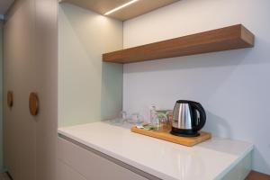 a kitchen with a coffee maker on a counter at Orkide Bodrum in Bodrum City
