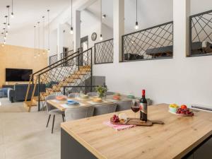 a kitchen with a table with a glass of wine at Villa Giulia by IstriaLux in Manjadvorci