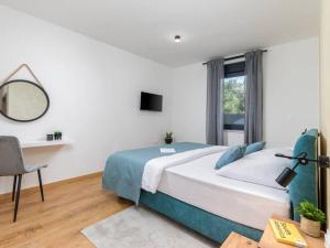 a bedroom with a bed and a desk and a window at Villa Giulia by IstriaLux in Manjadvorci +38 photos