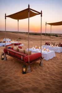 a table set up in the desert for a desert wedding at Limra Desert Camp With Swimming pool in Jaisalmer