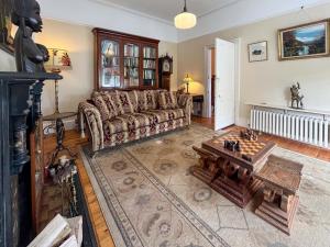 a living room with a couch and a table at Embleton House - Uk51597 in Berwick-Upon-Tweed +15 photos
