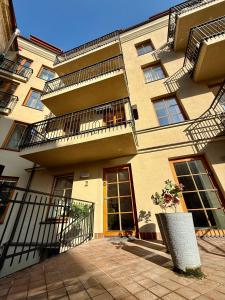 a large building with balconies on the side of it at Six Apartment Simona in Vilnius