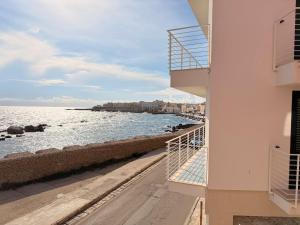 a view of the ocean from a balcony of a building at Tra Mare e Relax in Gallipoli
